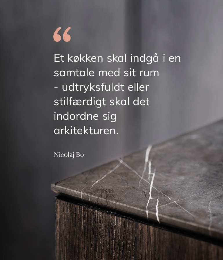 A quote in Danish from Nicolaj Bo explaining the philosophy behind the company's kitchens.